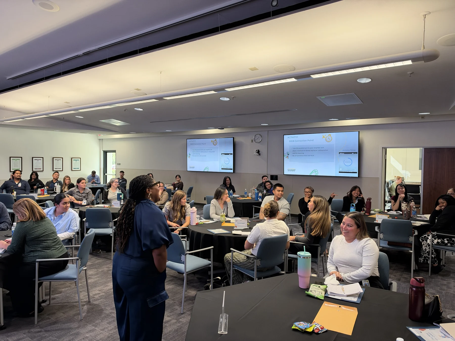 Angela facilitating a full training room